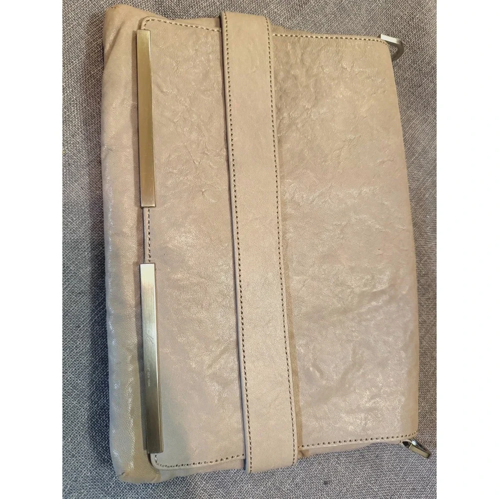 Beautiful Cream leather clutch with detachable shoulder strap by Kenneth Cole